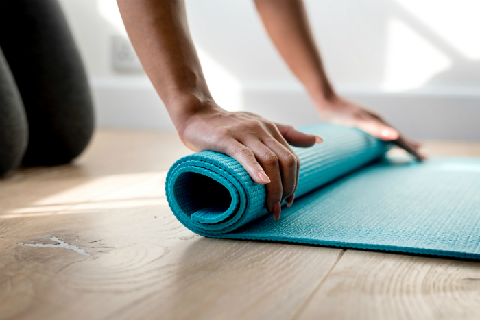 yoga pilates together rolling up mat